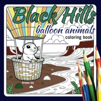 Coloring book cover with a prairie dog in a balloon over a canyon landscape.