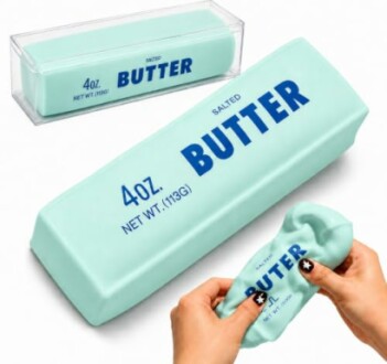 Butter-shaped stress relief toy being squeezed.