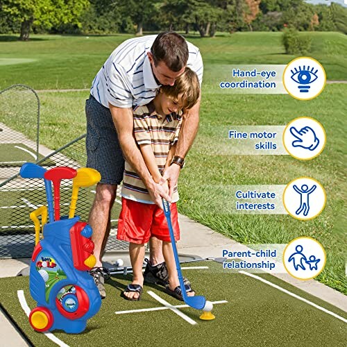 Father teaching son to play mini golf with toy set on grass.