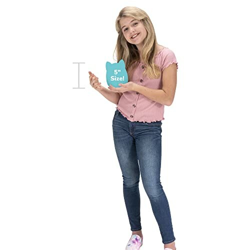 Girl holding a 5-inch cat-shaped item