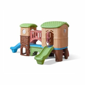 Colorful children's playground set with slides and climbing structures.
