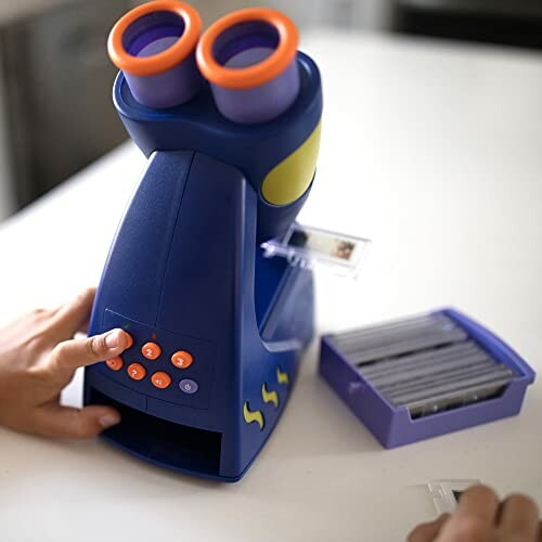 Child using a colorful toy microscope on a table.