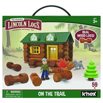 Lincoln Logs On the Trail building set with toy logs, cabin, figure, tree, and dog.