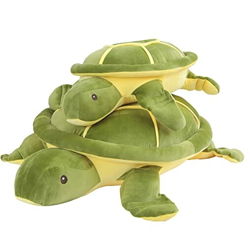 Two green plush turtle toys stacked on top of each other.