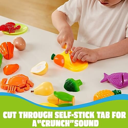 Child playing with a toy food cutting playset, featuring plastic fruits, vegetables, and seafood.