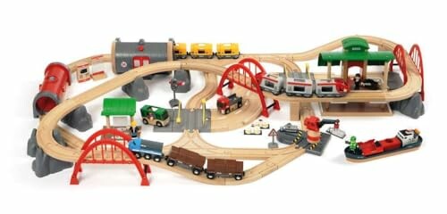 Wooden toy train set with tracks, bridges, and vehicles.